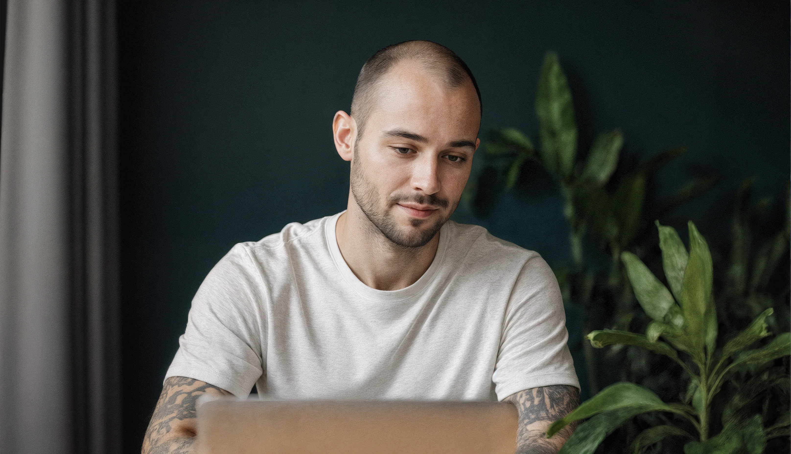 Person working with laptop in modern workspace